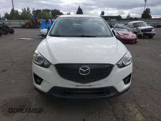 2014 Mazda CX-5 Grand Touring with VIN JM3KE4DY2E0354795, listed as a Copart auction lot 70713544 with 58,848 mi miles and Salvage Title. Bid and sale history available at DreamBid. Image 5.