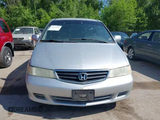 2004 Honda Odyssey EX-L with VIN 5FNRL18934B018040, listed as a IAAI auction lot 42241081 with 250,607 mi miles and . Bid and sale history available at DreamBid. Image 6.