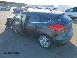 2015 Ford Focus Titanium z VIN 1FADP3N23FL368324, wystawiony jako IAAI lot #41387070 z przebiegiem Nie podano mil oraz . Historia ofert i sprzedaży dostępna na DreamBid. Obrazek 3.