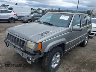 1998 Jeep Grand Cherokee Limited with VIN 1J4GZ88Z7WC223496, listed as a IAAI auction lot 41484317 with 244,567 mi miles. Bid and sale history available at carsss.com. Image 2.