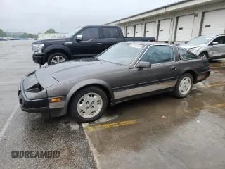 1984 Nissan 300ZX с VIN JN1HZ14S4EX005200, выставлен на аукционе Copart как лот 61509385 с пробегом 190 583 миль миль и Чистый • Clean title. История ставок и продаж доступна на DreamBid. Изображение 1.