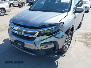 2020 Honda Pilot EX-L with VIN 5FNYF5H46LB004744, listed as a IAAI auction lot 42095298 with 76,159 mi miles and . Bid and sale history available at DreamBid. Image 6.