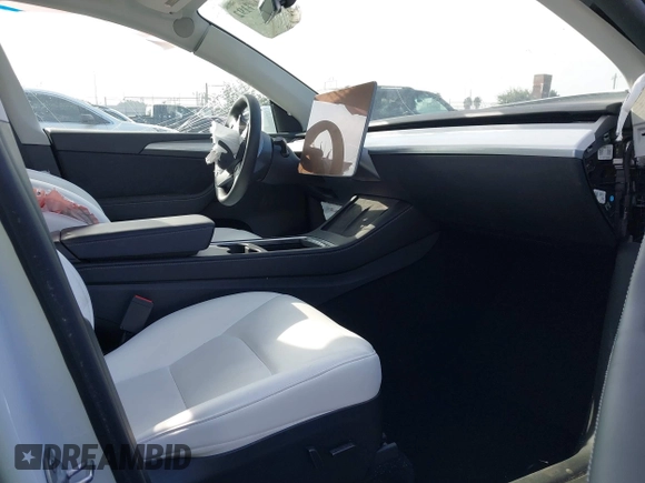 2023 Tesla Model Y Long Range with VIN 7SAYGDEE3PF900030, listed as a IAAI auction lot 41147192 with 13,903 mi miles and . Bid and sale history available at DreamBid. Image 5.