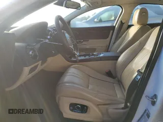 2016 Jaguar XJ with VIN SAJWA1CE4GMV91734, listed as a Copart auction lot 81005144 with 31,924 mi miles and Salvage Title. Bid and sale history available at DreamBid. Image 7.