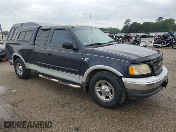 2000 Ford F-150 XL with VIN 1FTRX17L7YNC24292, listed as a Copart auction lot 58852925 with 213,318 mi miles and Salvage title. Bid and sale history available at DreamBid. Image 4.