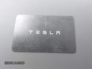 2021 Tesla Model Y Long Range with VIN 5YJYGDEE5MF085032, listed as a IAAI auction lot 41982925 with 64,541 mi miles and . Bid and sale history available at carsss.com. Image 11.