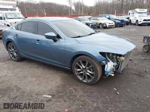 2017 Mazda 6 Grand Touring with VIN JM1GL1X52H1109210, listed as a IAAI auction lot 41738041 with 127,585 mi miles. Bid and sale history available at carsss.com. Image 1.
