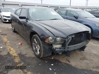 2011 Dodge Charger RT Plus with VIN 2B3CL5CT7BH521577, listed as a IAAI auction lot 41388986 with 135,009 mi miles. Bid and sale history available at carsss.com. Image 1.