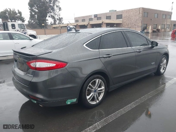 2015 Ford Fusion Energi Titanium with VIN 3FA6P0SU2FR173958, listed as a IAAI auction lot 41504220 with 170,235 mi miles. Bid and sale history available at carsss.com. Image 4.
