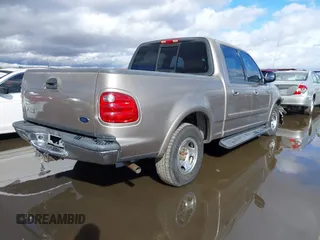 2003 Ford F-150 XLT with VIN 1FTRW07L53KD82167, listed as a IAAI auction lot 41745801 with 216,783 mi miles. Bid and sale history available at carsss.com. Image 4.