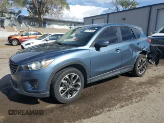 2016 Mazda CX-5 Grand Touring z VIN JM3KE2DY5G0603520, wystawiony jako Copart lot #55767465 z przebiegiem 110 421 mil mil oraz Szkoda całkowita • Salvage title. Historia ofert i sprzedaży dostępna na DreamBid. Obrazek 1.