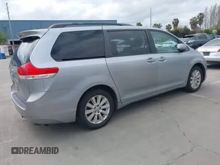 2014 Toyota Sienna LE with VIN 5TDJK3DC1ES080711, listed as a IAAI auction lot 41910679 with 118,788 mi miles and . Bid and sale history available at DreamBid. Image 4.