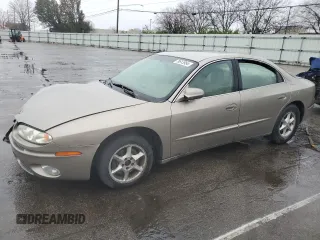 2001 Oldsmobile Aurora z VIN 1G3GR64H214292879, wystawiony jako Copart lot #79613954 z przebiegiem 88 709 mil mil oraz Szkody całkowita. Historia ofert i sprzedaży dostępna na DreamBid. Obrazek 1.