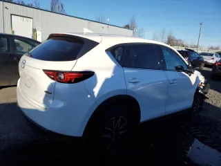 2018 Mazda CX-5 Grand Touring z VIN JM3KFBDM6J0337006, wystawiony jako Copart lot #87155694 z przebiegiem 50 643 mil mil oraz Szkoda całkowita • Salvage title. Historia ofert i sprzedaży dostępna na DreamBid. Obrazek 3.