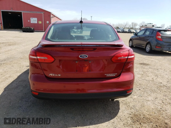2016 Ford Focus Titanium z VIN 1FADP3J24GL272970, wystawiony jako Copart lot #54539215 z przebiegiem 60 007 mil mil oraz Czysty tytuł • Clean title. Historia ofert i sprzedaży dostępna na DreamBid. Obrazek 6.