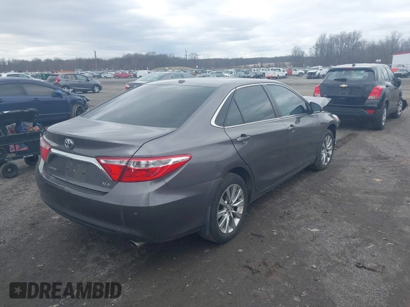2015 Toyota Camry XLE with VIN 4T1BF1FKXFU936775, listed as a IAAI auction lot 41807486 with 97,148 mi miles and . Bid and sale history available at DreamBid. Image 4.