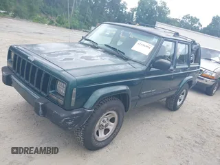 2000 Jeep Cherokee z VIN 1J4FT48S4YL265734, wystawiony jako IAAI lot #42556994 z przebiegiem 228 162 mil mil oraz . Historia ofert i sprzedaży dostępna na DreamBid. Obrazek 2.