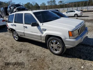 1996 Jeep Grand Cherokee Laredo with VIN 1J4FX58SXTC349575, listed as a Copart auction lot 80545584 with 302,636 mi miles and Salvage Title. Bid and sale history available at carsss.com. Image 4.