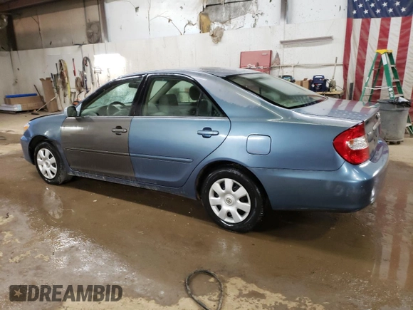 2004 Toyota Camry LE with VIN 4T1BE32K64U812388, listed as a Copart auction lot 82777563 with 209,219 mi miles and Clean Title. Bid and sale history available at carsss.com. Image 2.