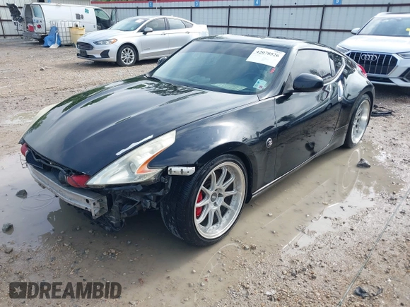 2013 Nissan 370Z with VIN JN1AZ4EH9DM880407, listed as a IAAI auction lot 42078526 with 216,029 mi miles. Bid and sale history available at carsss.com. Image 2.