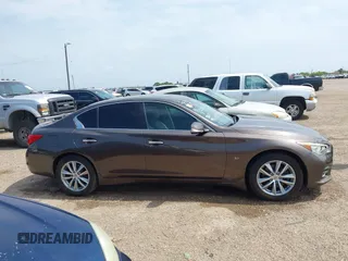 2014 Infiniti Q50 Sport with VIN JN1BV7ARXEM690925, listed as a IAAI auction lot 42163630 with 130,931 mi miles and . Bid and sale history available at carsss.com. Image 13.