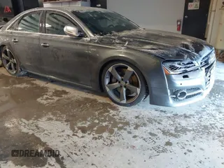 2015 Audi S8 with VIN WAUK2AFD0FN005369, listed as a IAAI auction lot 41312743 with 76,750 mi miles. Bid and sale history available at carsss.com. Image 1.