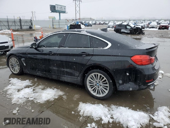 2015 BMW 4 Series 428i xDrive with VIN WBA4C9C54FD330601, listed as a Copart auction lot 45168955 with 112,408 mi miles and Salvage title. Bid and sale history available at DreamBid. Image 2.