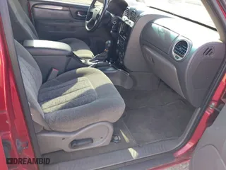 2004 GMC Envoy SLE with VIN 1GKDT13S442157704, listed as a IAAI auction lot 41907592 with NaN miles. Bid and sale history available at carsss.com. Image 5.