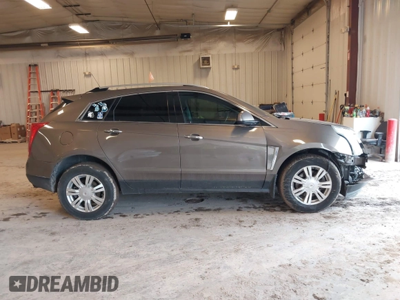 2015 Cadillac SRX Luxury Collection with VIN 3GYFNBE34FS575613, listed as a IAAI auction lot 41697251 with 173,117 mi miles and . Bid and sale history available at DreamBid. Image 13.