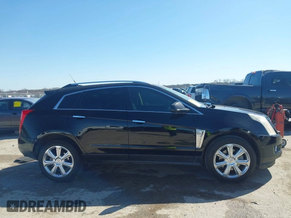 2014 Cadillac SRX Performance Collection z VIN 3GYFNCE35ES517868, wystawiony jako IAAI lot #41775522 z przebiegiem 166 960 mil mil oraz . Historia ofert i sprzedaży dostępna na DreamBid. Obrazek 13.