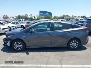 2021 Toyota Prius LE with VIN JTDKAMFPXM3170372, listed as a IAAI auction lot 42661609 with 47,977 mi miles and . Bid and sale history available at DreamBid. Image 14.