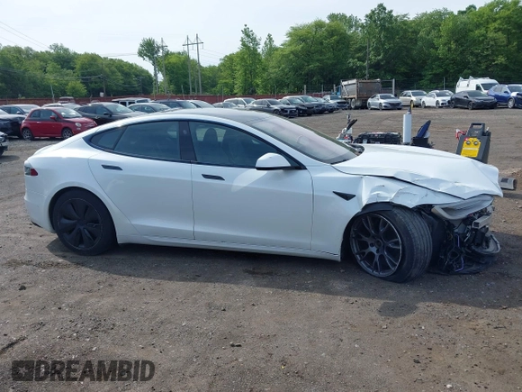 2022 Tesla Model S with VIN 5YJSA1E58NF467644, listed as a IAAI auction lot 42344403 with 52,628 mi miles and . Bid and sale history available at DreamBid. Image 13.