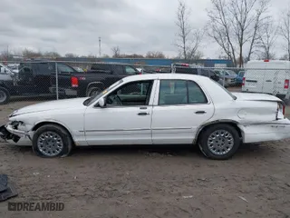 2004 Mercury Grand Marquis GS with VIN 2MEFM74W24X628573, listed as a IAAI auction lot 41922123 with 104,395 mi miles. Bid and sale history available at carsss.com. Image 14.