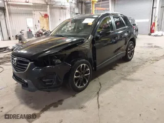 2016 Mazda CX-5 Grand Touring with VIN JM3KE2DY9G0635368, listed as a IAAI auction lot 41699616 with 240,619 mi miles. Bid and sale history available at carsss.com. Image 2.