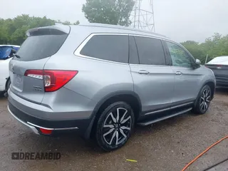 2019 Honda Pilot Touring 8-Passenger with VIN 5FNYF6H98KB097105, listed as a IAAI auction lot 42353009 with 133,212 mi miles and . Bid and sale history available at DreamBid. Image 4.