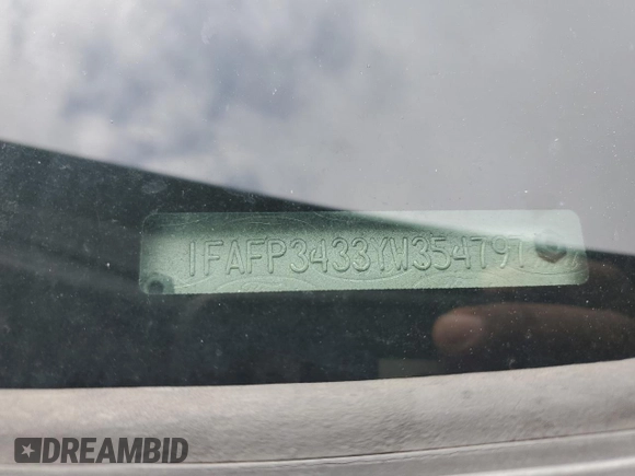 2000 Ford Focus SE with VIN 1FAFP3433YW354797, listed as a Copart auction lot 61430265 with 165,202 mi miles and Salvage title. Bid and sale history available at DreamBid. Image 12.