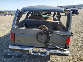 1989 Ford Bronco with VIN 1FMCU14T0KUA33910, listed as a Copart auction lot 57730195 with 53,335 mi miles and Salvage title. Bid and sale history available at DreamBid. Image 6.