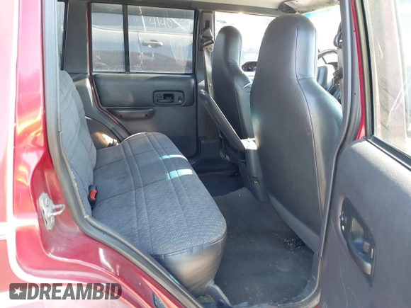 1999 Jeep Cherokee Sport with VIN 1J4FF68S4XL552718, listed as a IAAI auction lot 41443871 with 310,874 mi miles and . Bid and sale history available at DreamBid. Image 8.