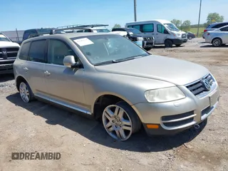 2004 Volkswagen Touareg with VIN WVGCM67L44D033856, listed as a IAAI auction lot 42142143 with 105,682 mi miles and . Bid and sale history available at DreamBid. Image 1.