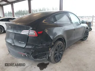 2023 Tesla Model Y Long Range with VIN 7SAYGAEEXPF707503, listed as a IAAI auction lot 41712166 with 27,467 mi miles and . Bid and sale history available at carsss.com. Image 4.