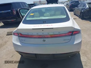 2013 Lincoln MKZ z VIN 3LN6L2G90DR824857, wystawiony jako IAAI lot #42229016 z przebiegiem Nie podano mil oraz . Historia ofert i sprzedaży dostępna na DreamBid. Obrazek 16.