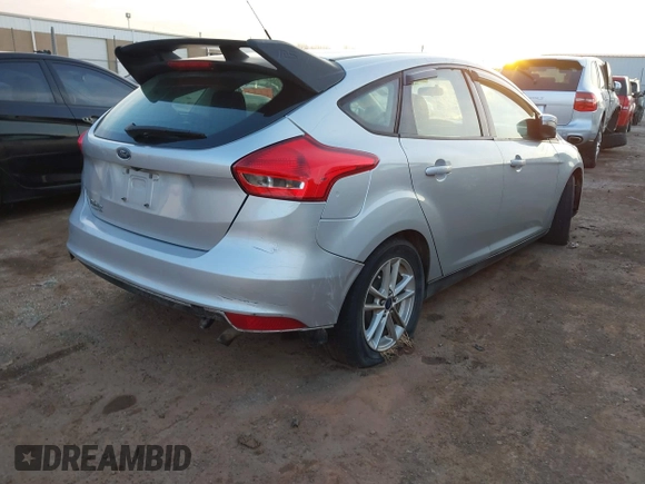 2015 Ford Focus SE with VIN 1FADP3K22FL282457, listed as a IAAI auction lot 41872989 with 98,590 mi miles. Bid and sale history available at carsss.com. Image 4.