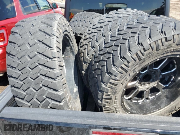 2023 Jeep Gladiator Rubicon with VIN 1C6JJTBG7PL573197, listed as a Copart auction lot 53866075 with 19,521 mi miles and Salvage title. Bid and sale history available at DreamBid. Image 12.