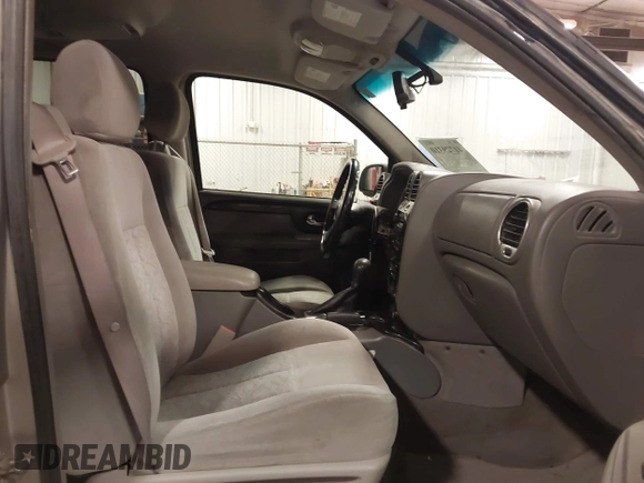 2005 GMC Envoy SLE with VIN 1GKET16S656102522, listed as a IAAI auction lot 41729310 with 233,049 mi miles. Bid and sale history available at carsss.com. Image 5.