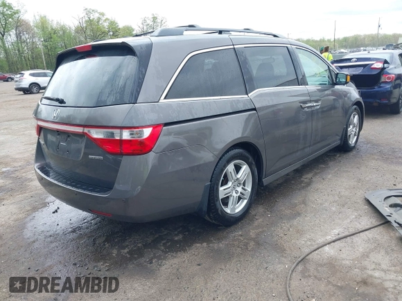 2013 Honda Odyssey Touring with VIN 5FNRL5H94DB013310, listed as a IAAI auction lot 42079565 with 128,622 mi miles and . Bid and sale history available at carsss.com. Image 4.