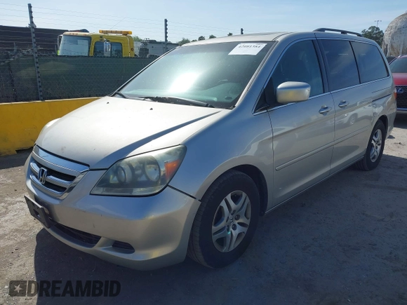 2005 Honda Odyssey EX-L with VIN 5FNRL38705B008884, listed as a IAAI auction lot 42081384 with 219,336 mi miles. Bid and sale history available at carsss.com. Image 2.