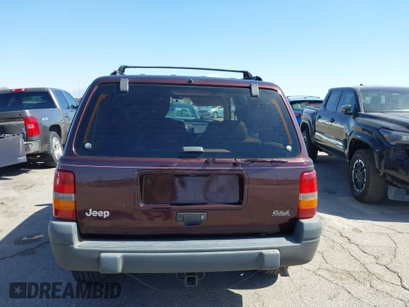 1996 Jeep Grand Cherokee Laredo with VIN 1J4GZ58S3TC391942, listed as a IAAI auction lot 41711778 with 202,765 mi miles. Bid and sale history available at carsss.com. Image 17.