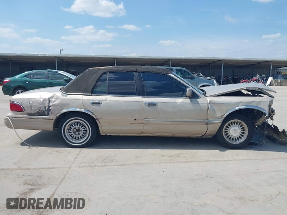 1997 Mercury Grand Marquis LS with VIN 2MELM75W3VX707138, listed as a IAAI auction lot 40055743 with 198,489 mi miles and . Bid and sale history available at DreamBid. Image 14.