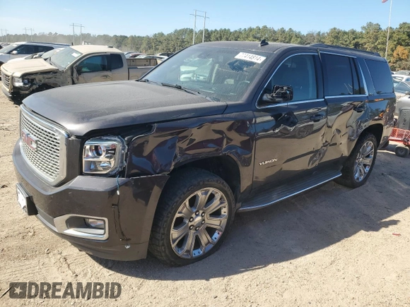 2015 GMC Yukon SLT with VIN 1GKS1BKC0FR239629, listed as a Copart auction lot 77414814 with 171,611 mi miles and Salvage Title. Bid and sale history available at carsss.com. Image 1.