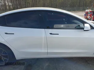 2022 Tesla Model 3 with VIN 5YJ3E1EA5NF124148, listed as a IAAI auction lot 41908884 with 45,115 mi miles. Bid and sale history available at carsss.com. Image 14.